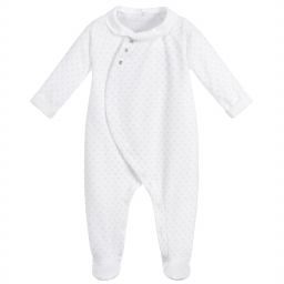 Laranjinha unisex white velour babygrow which  has a dotty green print. It closes to front with concealed poppers, over which are pretty little mother-of-pearl buttons. The collar and cuffs are made in white cotton.AW 18 18414