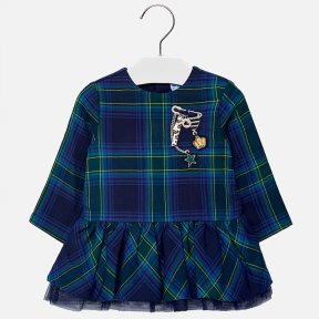 Mayoral, long sleeved tartan dress. Fully lined with a double layer of netting under the frilled skirt. The front of the dress is embellished with a pin, ribbon and crown motif, The dress has a concealed zip fastening to the back.