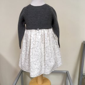 Wedoble winter dress. Grey fine knit long sleeved top. White cotton lined skirt with cute cat print. Full length button fastening to the back.