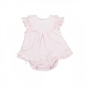  pink dress and pants set by Tutto Piccolo,  lightweight cotton. heart embroidered on the chest with a lace & ruffle detail. There is also a ruffle detail to the hem and sleeves. The pants are elasticated around the waist and have cute bows on each leg. 8