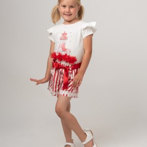 Caramelo Kids,  white top, short sleeves, shoulder frills, a red lighthouse print,  tulle flowers, pearls, diamanté detail. red and white stripe shorts, adjustable elasticated waist,  ribbon belt, lace trim. 019092 