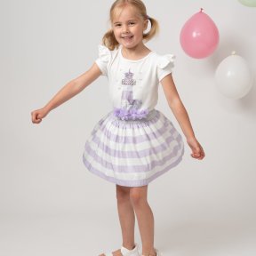 Caramelo Kids,  white top, short sleeves, shoulder frills, a lilac lighthouse print,  tulle flowers, pearls, diamanté detail. a lilac and white stripe skirt, glittery silver elasticated waist,  tulle lining. 012285  