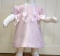 Pretty Originals pale pink 2 piece dress and jam-pants set. Fully line, full length button fastening to the back. Silver sparkle detail to the material. Lace embellishment to the capped sleeves and front. 2 large satin bows on the chest. Matching jam-pant